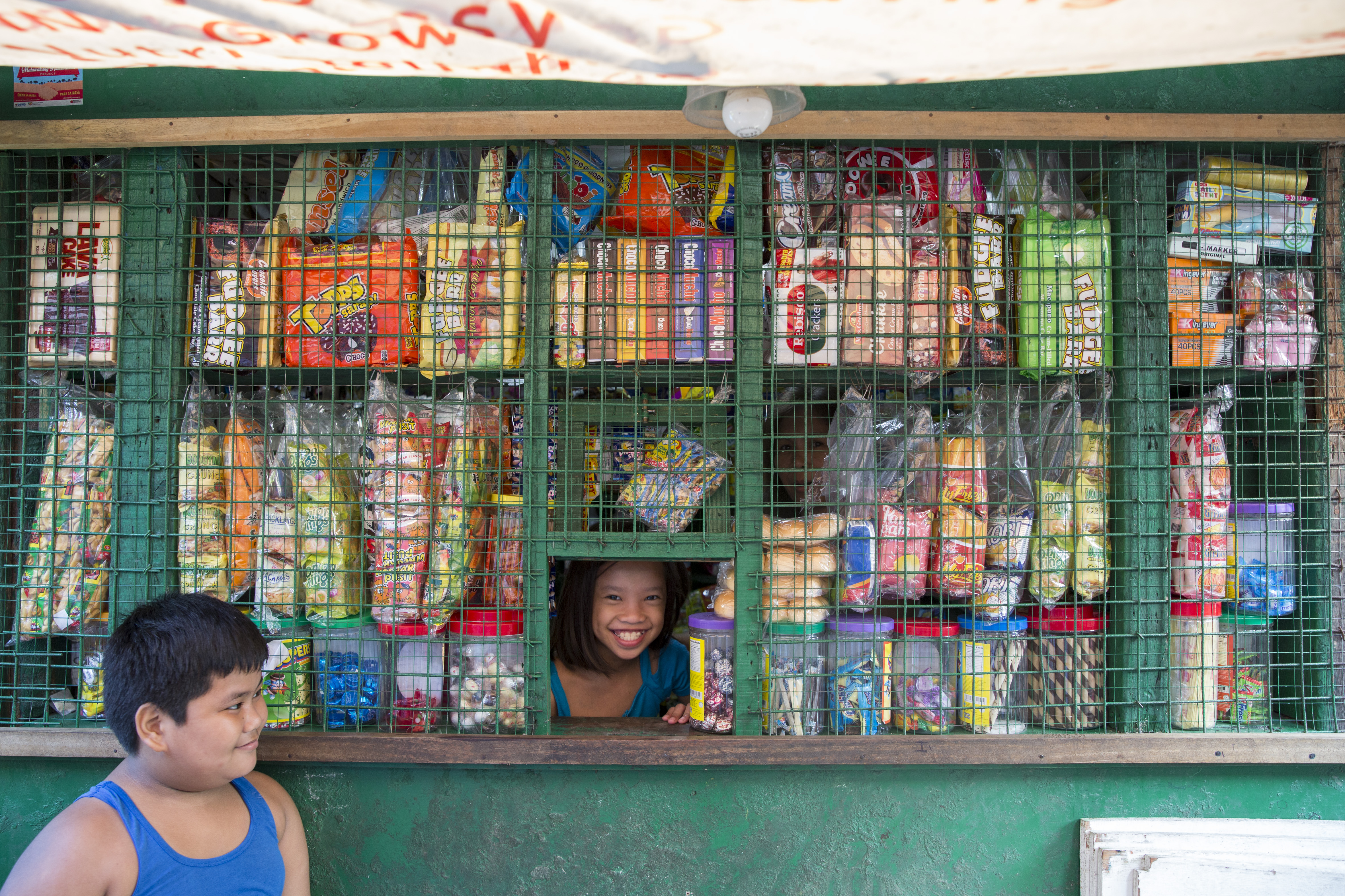 Girl In Little Shop Window
