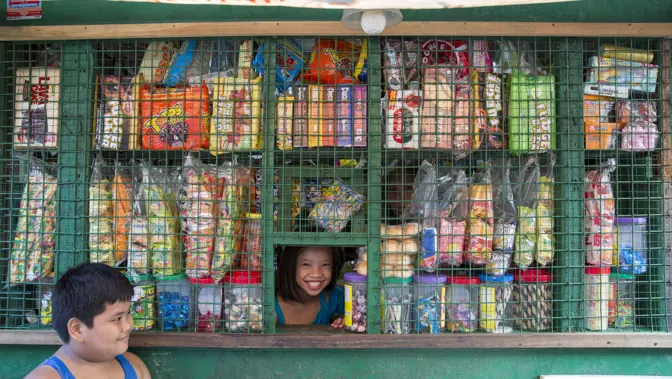 Girl In Little Shop Window