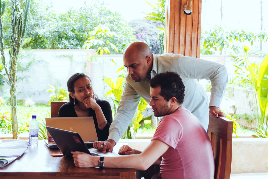 Impact Hub People Looking At Laptops