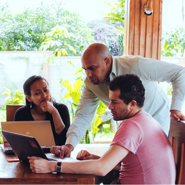 Impact Hub People Looking At Laptops