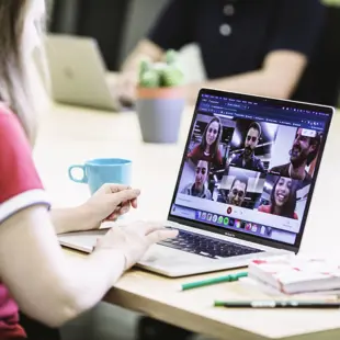 2129 Woman With Laptop In Online Meeting Courtesy Bridge Of Billions