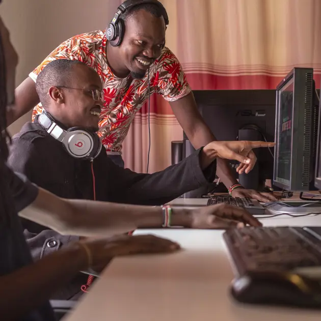 Men pointing at screen