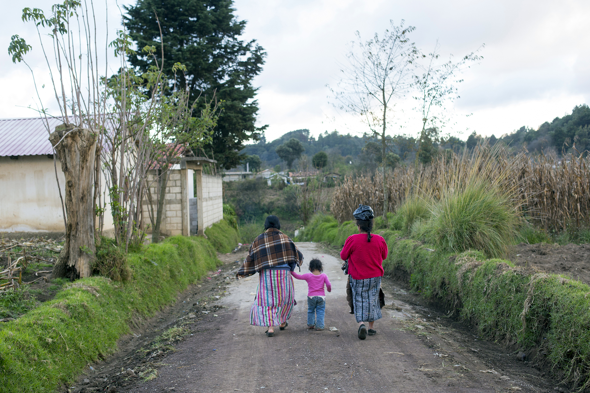2123 Woman Walking In Guatemalan Village Copyright Stuart Freedman