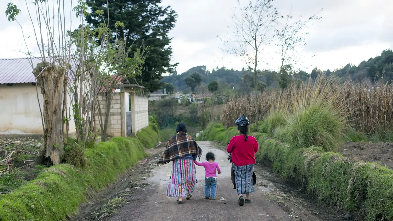2123 Woman Walking In Guatemalan Village Copyright Stuart Freedman