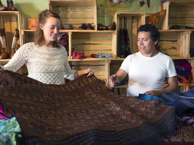11 Man And Woman Examining Fabric Agora Teysha Copyright Stuart Freedman