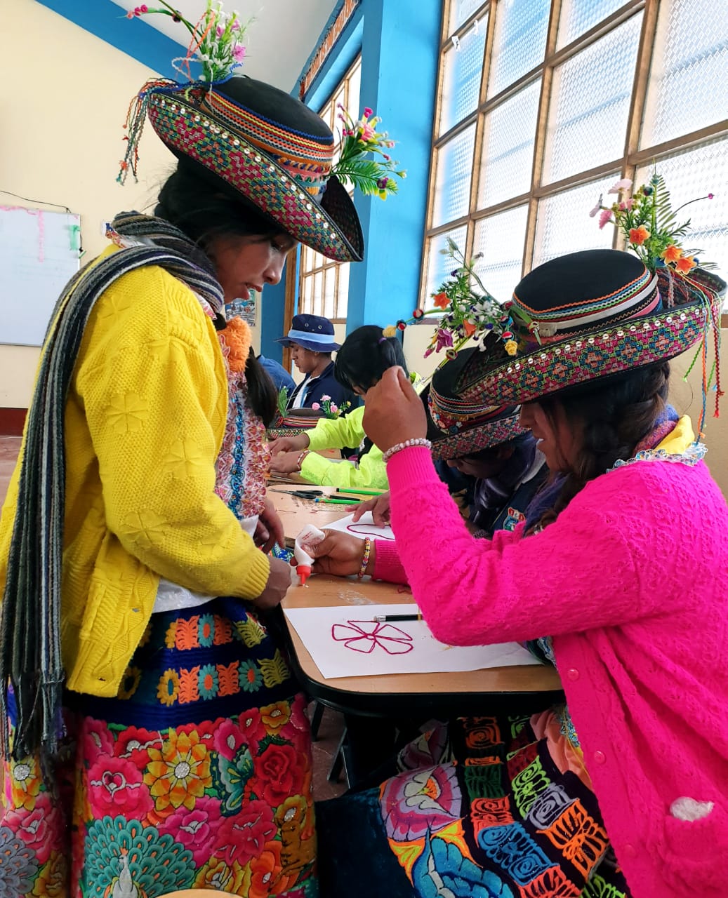College students with hats making crafts