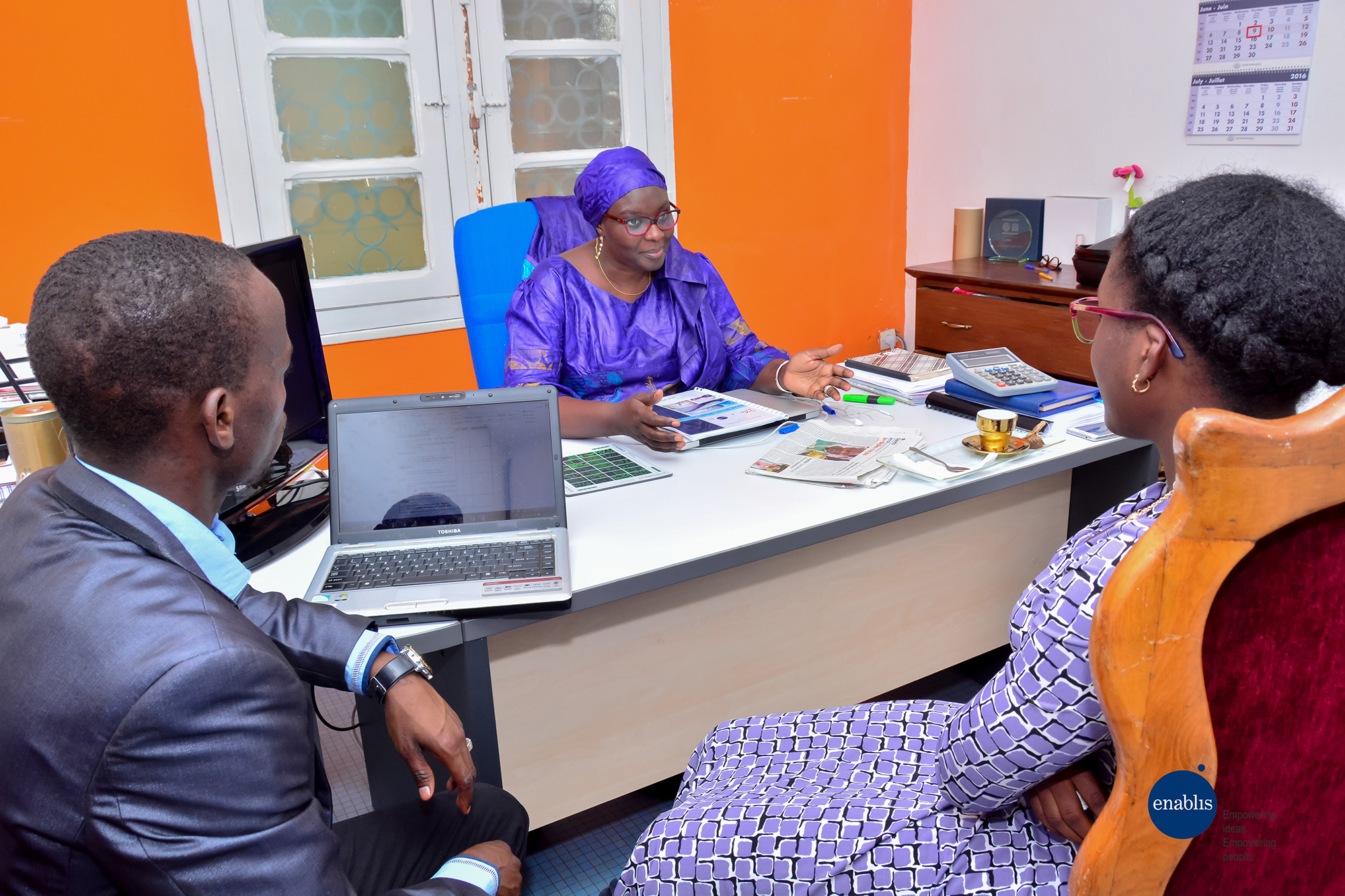 2114 Two Women And A Man In Meeting Courtesy Enablis