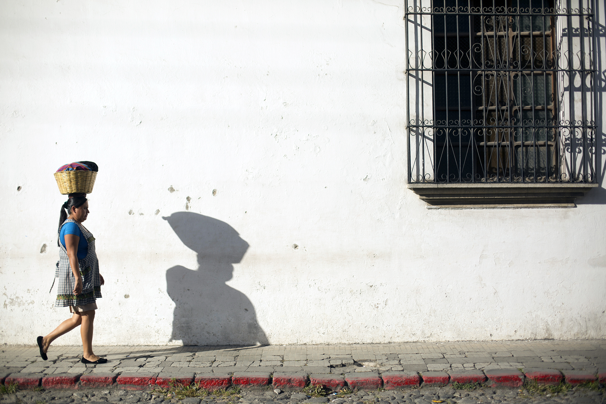 2124 Woman With Basket On Head In Guatemalan Village Copyright Stuart Freedman