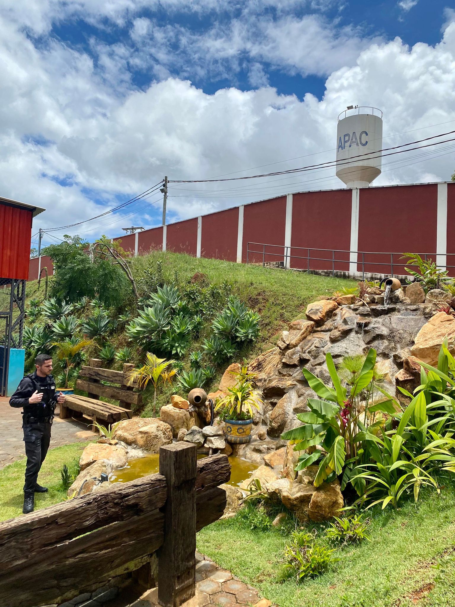 Prison Guard Examines Landscape In Apac Prison