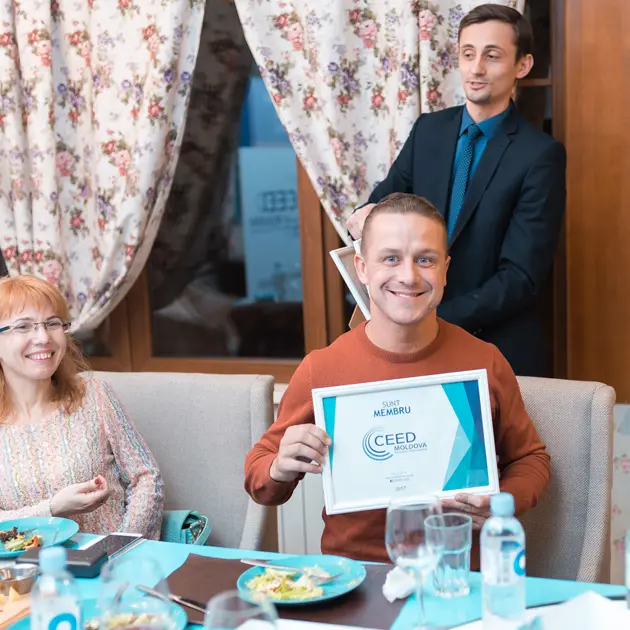 2126 Man Holding Ceed Certificate Courtesy Ceed