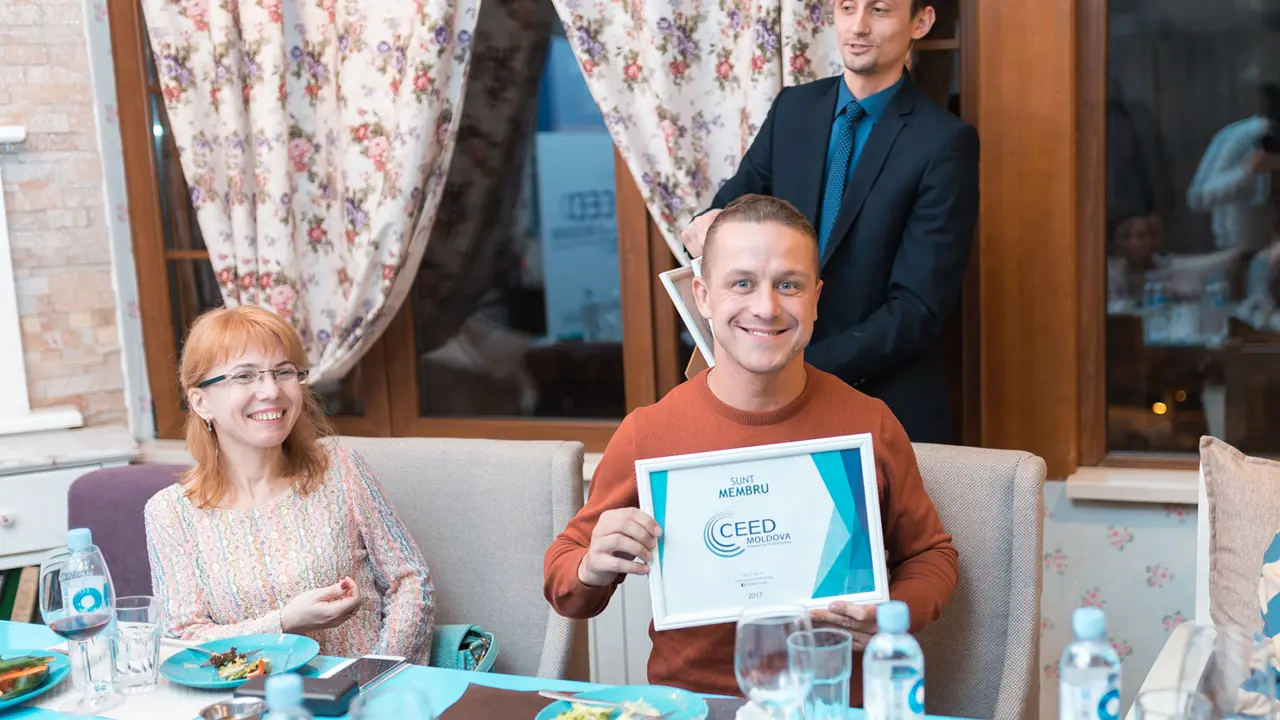 2126 Man Holding Ceed Certificate Courtesy Ceed