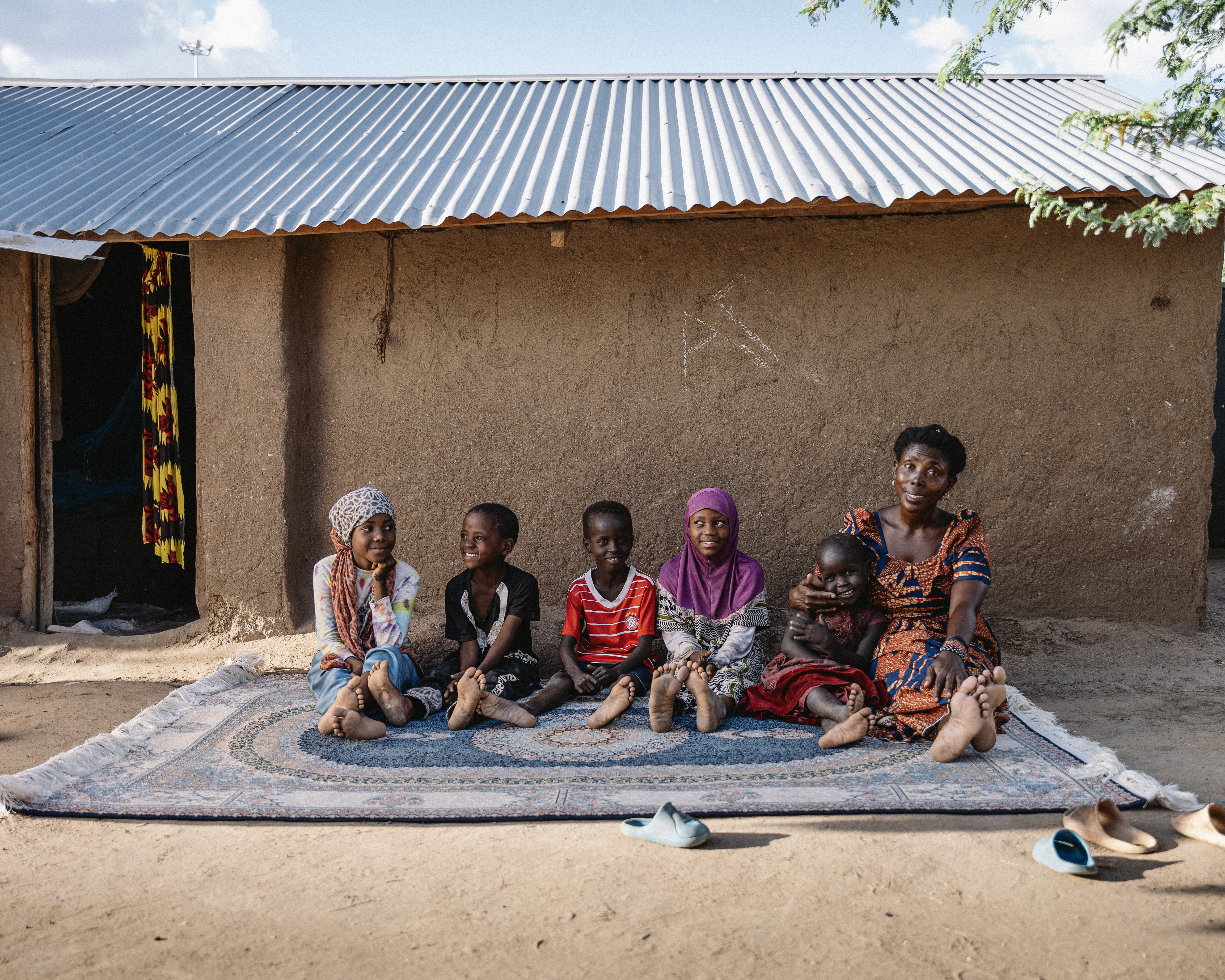 Children and mother sitting together