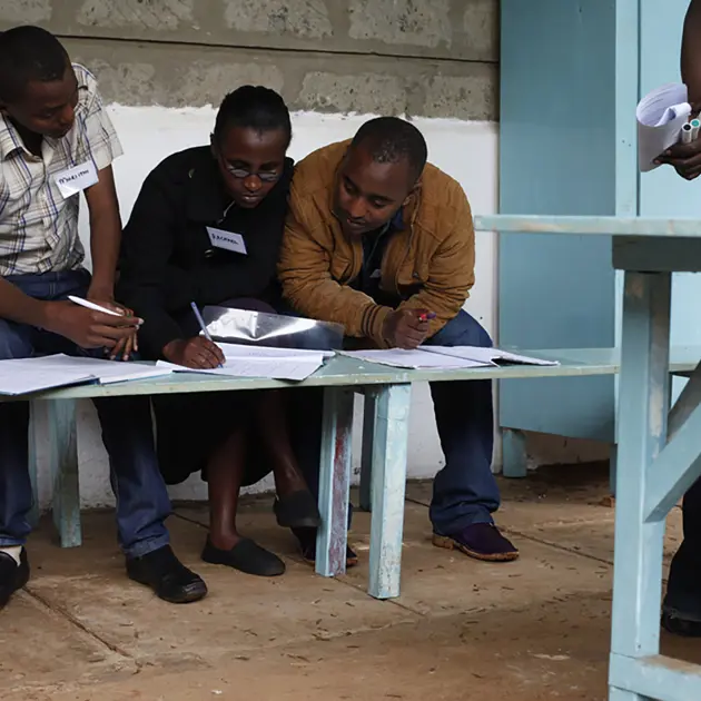 2121 Three Men Writing On A Bench Village Nut Root Capital Stuart Freedman