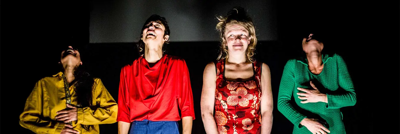 Four women laughing