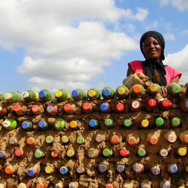 Woman with plastic bottles Sina Construction 2023