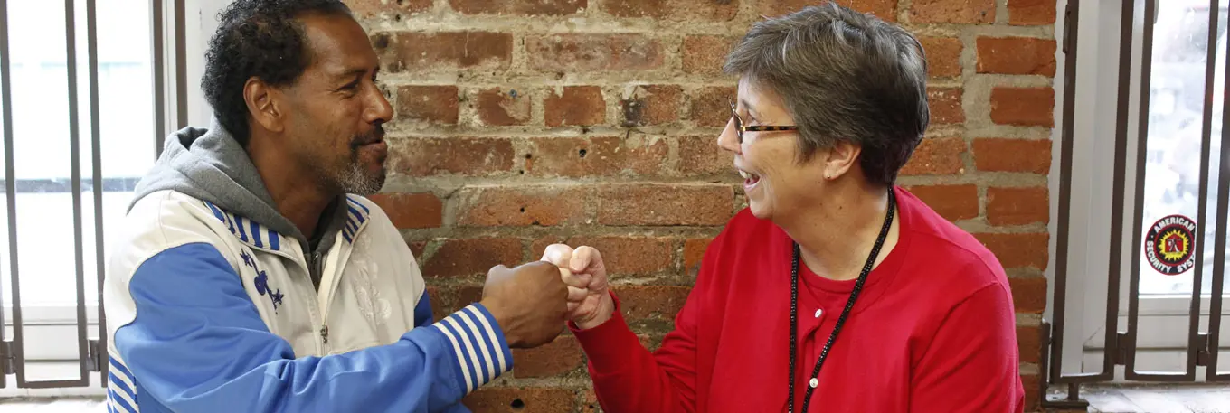 CAREERS Fist Bump St John Bread And Life Copyright Stuart Freedman