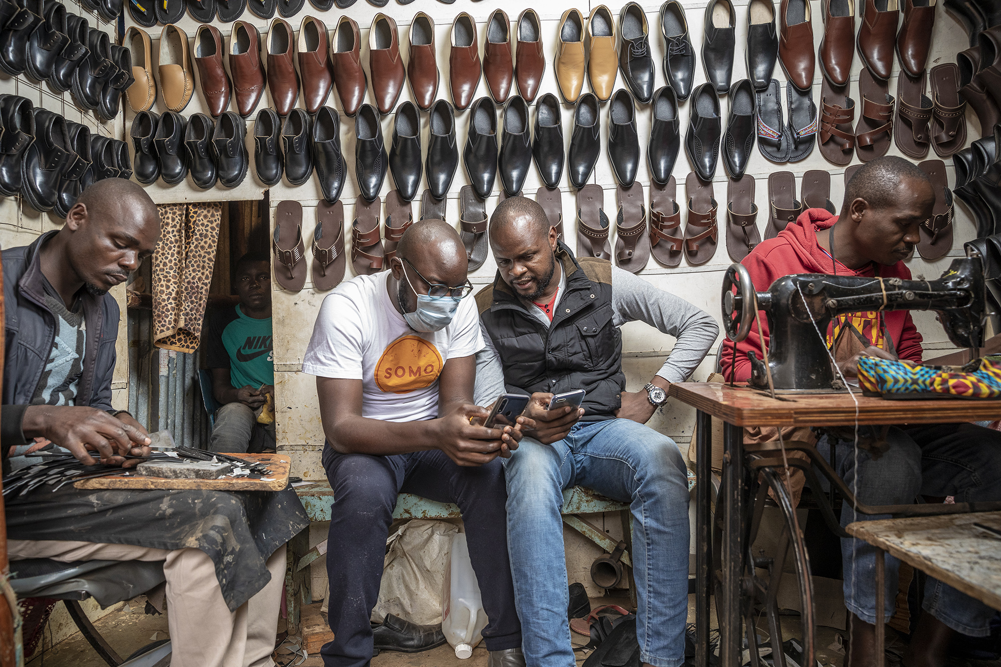 2134 Five Men In Shoe Shop Somo Copyright Sven Torfinn Panos