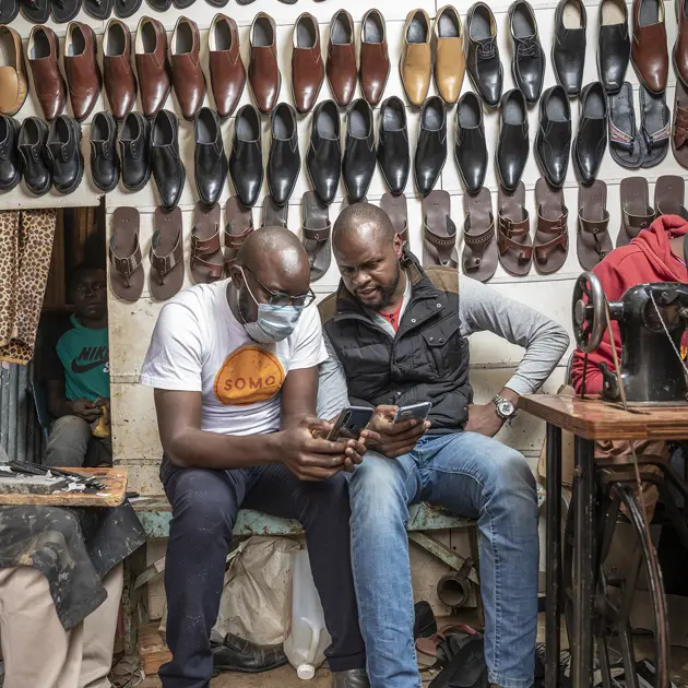 2134 Five Men In Shoe Shop Somo Copyright Sven Torfinn Panos