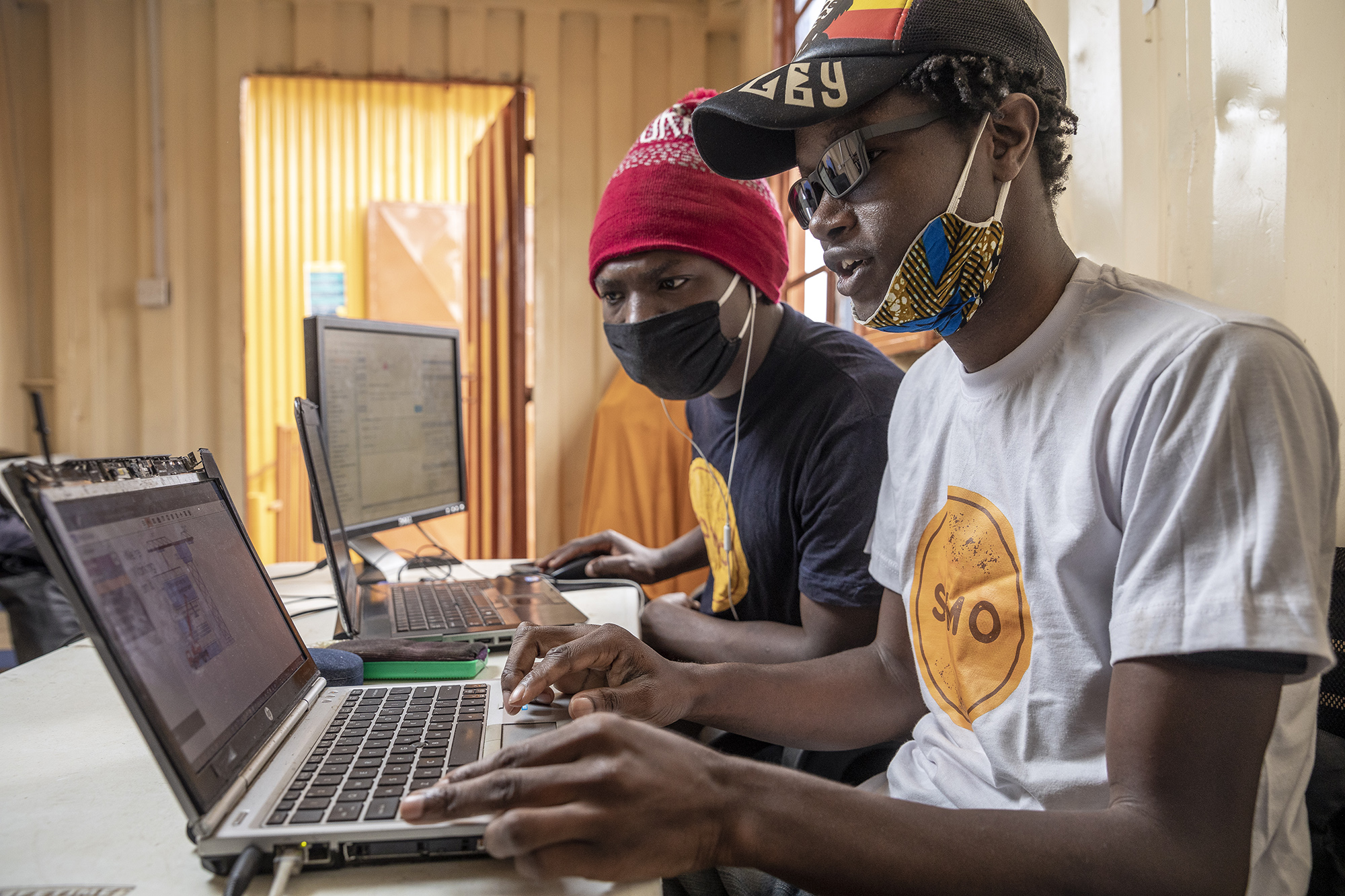 Men Working On Laptops Somo