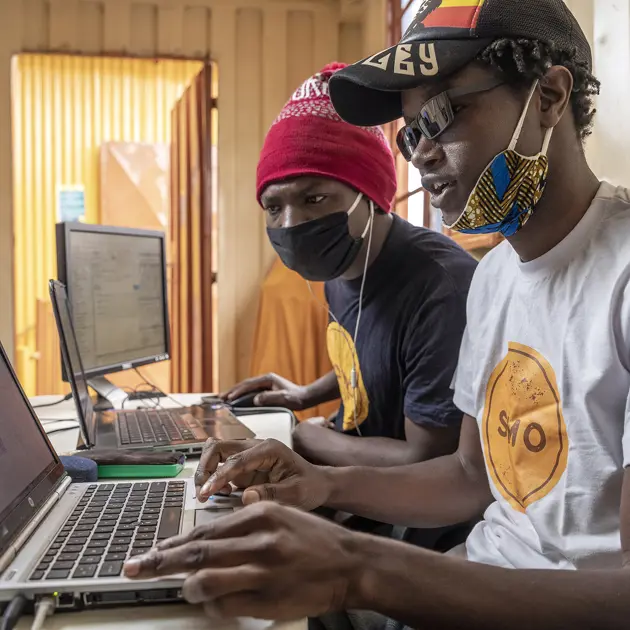 Men Working On Laptops Somo
