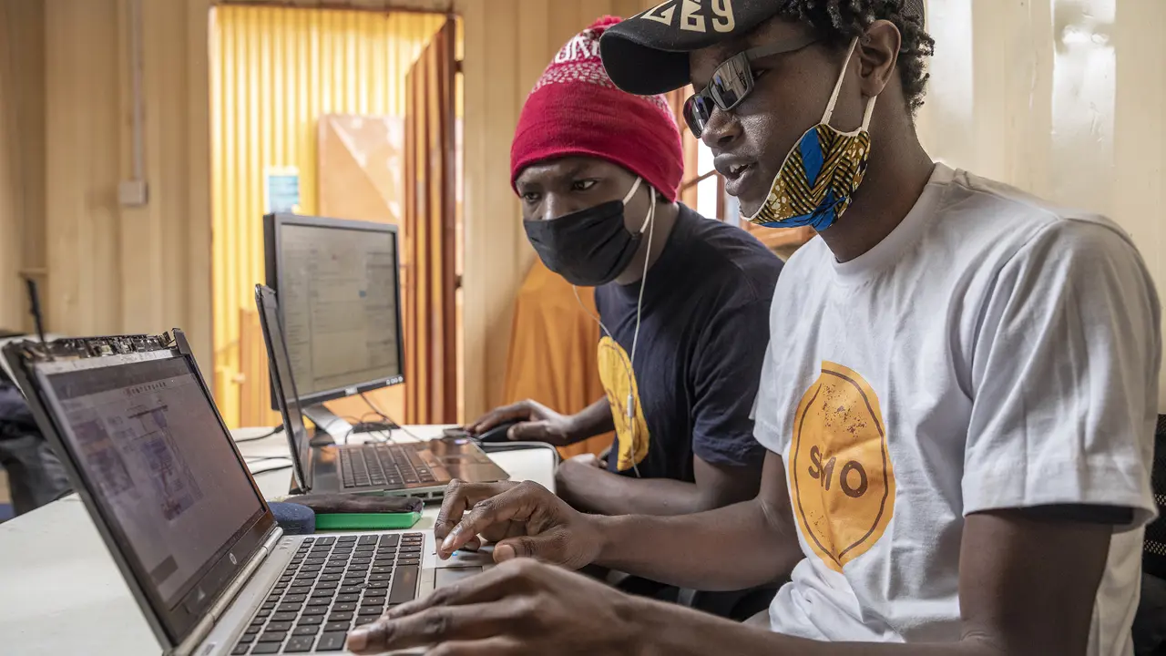 Men Working On Laptops Somo